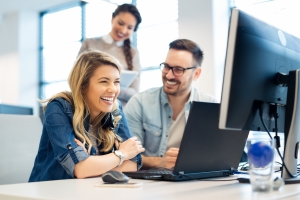 Group of business people and software developers working as a te