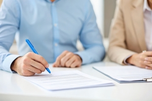 Fashion Boutique Owner Signing Insurance Policy