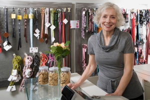 Smiling Pet Shop Owner with Transection Machine