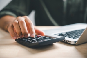 Business Owner Calculating Coverage in Retail Insurance