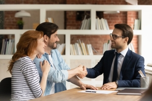 Shop Owners Shaking Hand with Insurance Agent