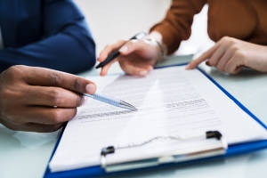 Auditors Analysing Workers Compersation Insurance Documents