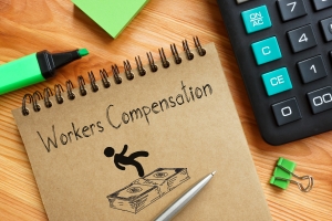 Workers Compensation Text with A Falling Employee Over Dollars Stack Sketch