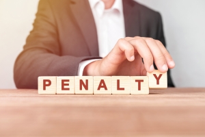 Man Making Word Penalty with Wooden Blocks
