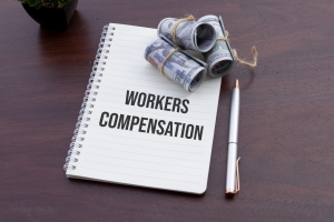 Notebook with Workers Compensation Text Pen and Cash